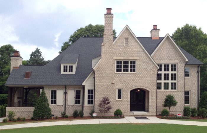 Design a one-of-a-kind new home with custom brick design ideas, including arches, window surrounds, fireplaces, and feature walls.