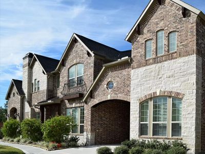 Explore unique ways to use custom brick design in new home construction with architectural details, decorative brick patterns, interior features, and unique exterior design.